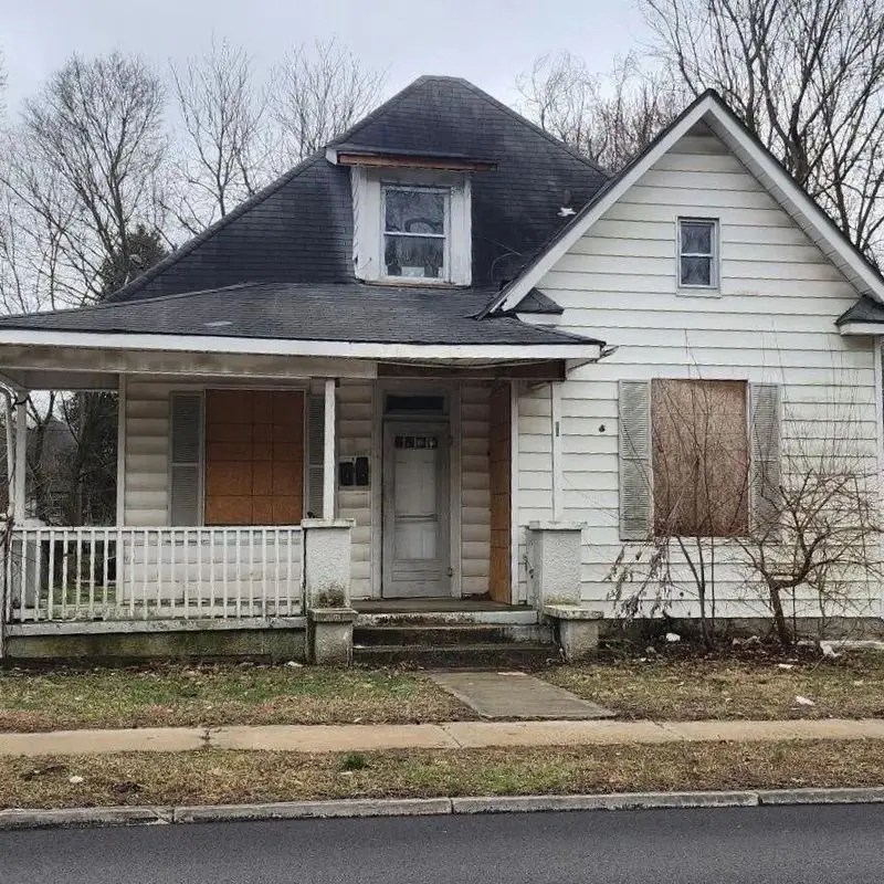 Boarded-up distressed property