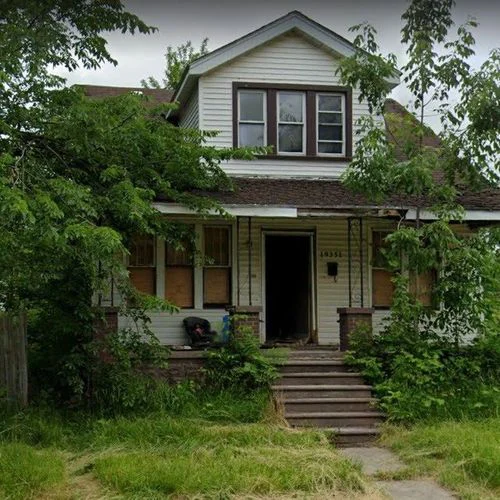 Abandoned property with overgrown lot